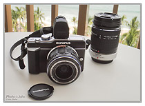 Olympus E-PL1 with kit lens and Four Thirds 40-150mm f/4.0-5.6