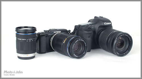 Olympus E-PL2 with 75-300mm next to Canon EOS 7D