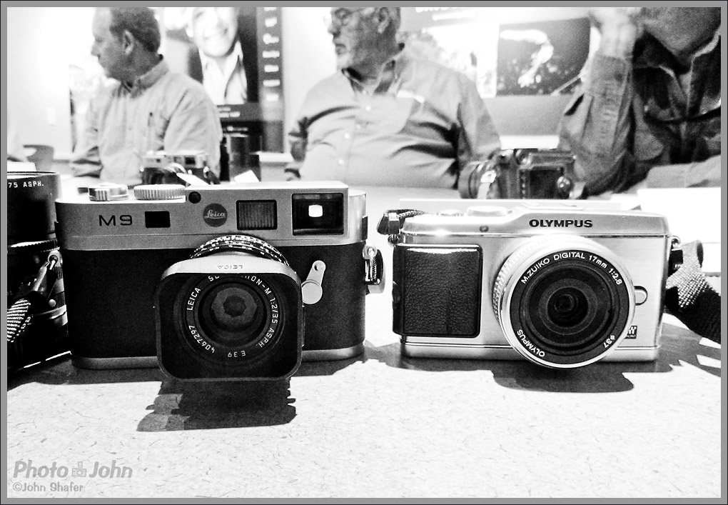 Leica M9 digital rangefinder next to the Olympus E-P3 Micro Four Thirds camera