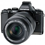 New Olympus 75-300mm f/4.8-6.7 II Zoom Lens On Black OM-D E-M5 - Angle