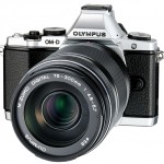 New Olympus 75-300mm f/4.8-6.7 II Zoom Lens On Silver OM-D E-M5 - Angle