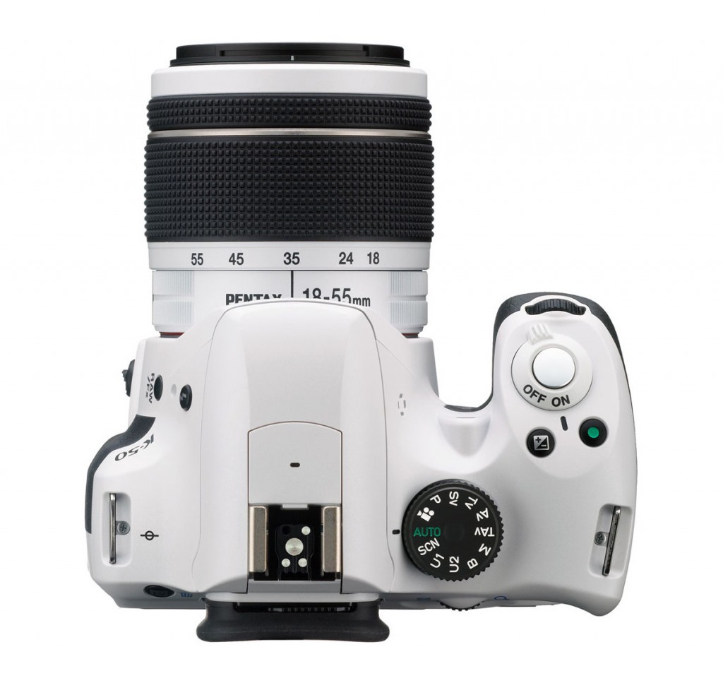 White Pentax K-50 DSLR - Top View With White Kit Lens