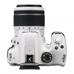 White Pentax K-50 DSLR - Top View With White Kit Lens